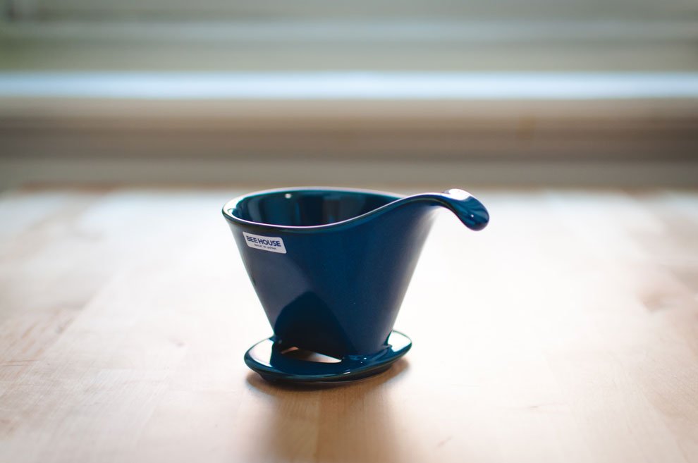 Blue Beehouse porcelain dripper on a wooden table