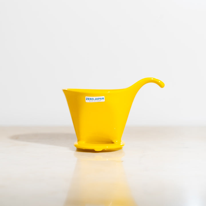 A vibrant yellow porcelain beehouse coffee dripper from Zero Japan
