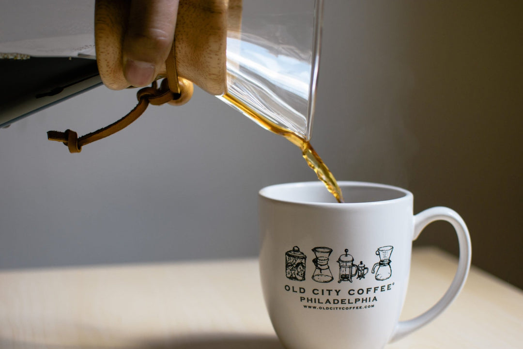 Close-up of coffee pouring from the Chemex spout into an Old City Coffee Philadelphia mug