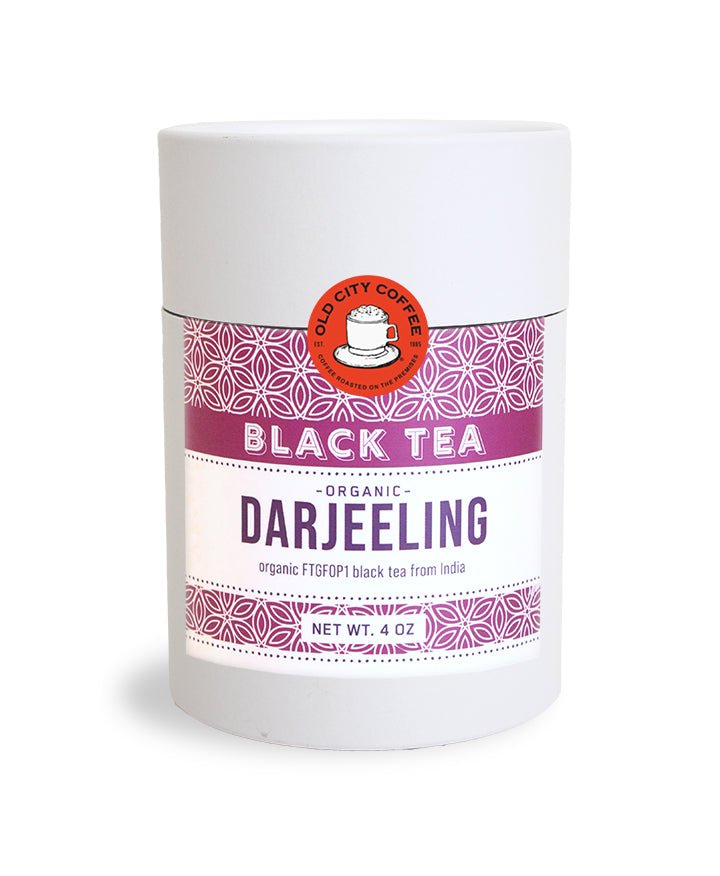 White Old City Coffee canister of organic Darjeeling black tea with a maroon patterned label