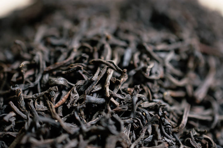 Detailed close-up of twisted decaf Ceylon tea leaves