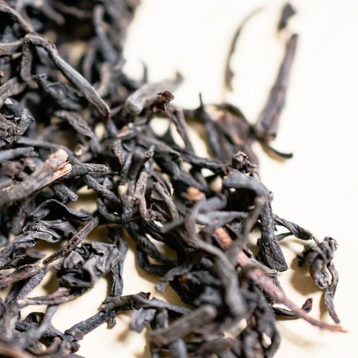 Macro view of dark decaf Ceylon tea leaves
