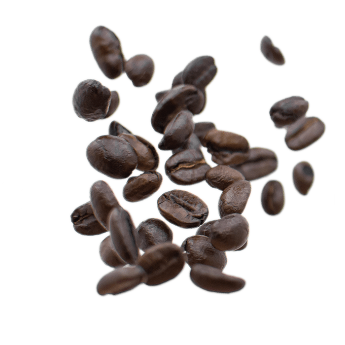 Roasted decaf coffee beans scattered on a white background