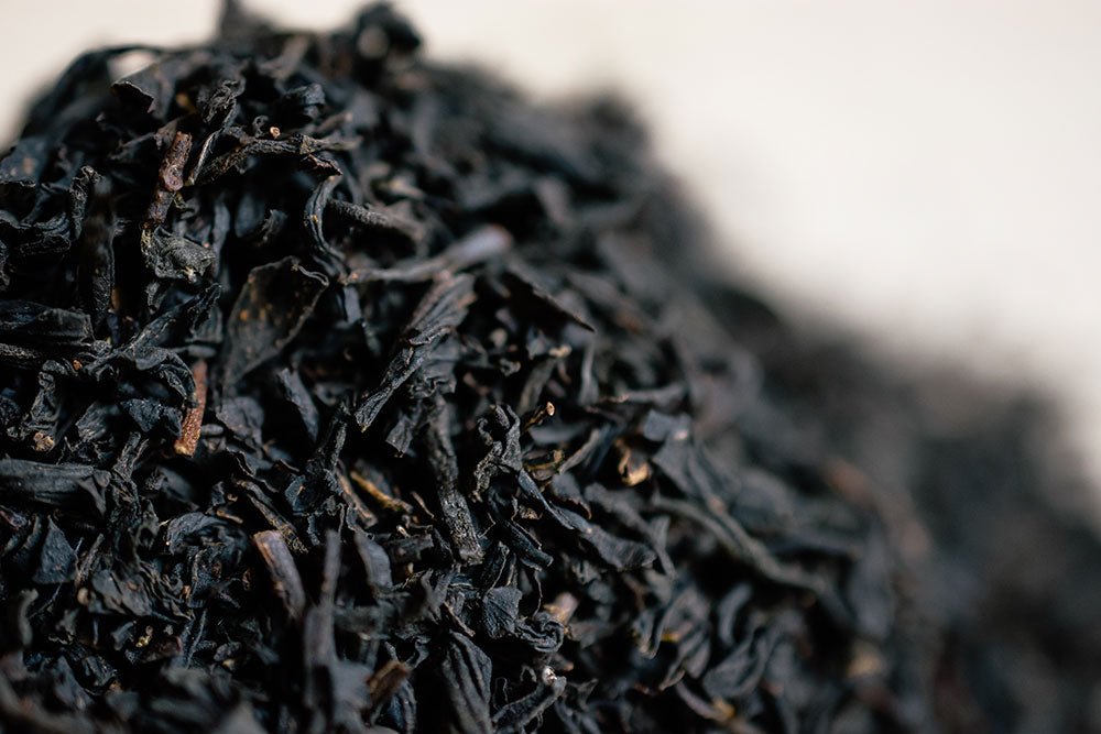 Macro view of dark Earl Grey tea leaves