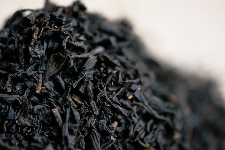 Macro view of dark Earl Grey tea leaves