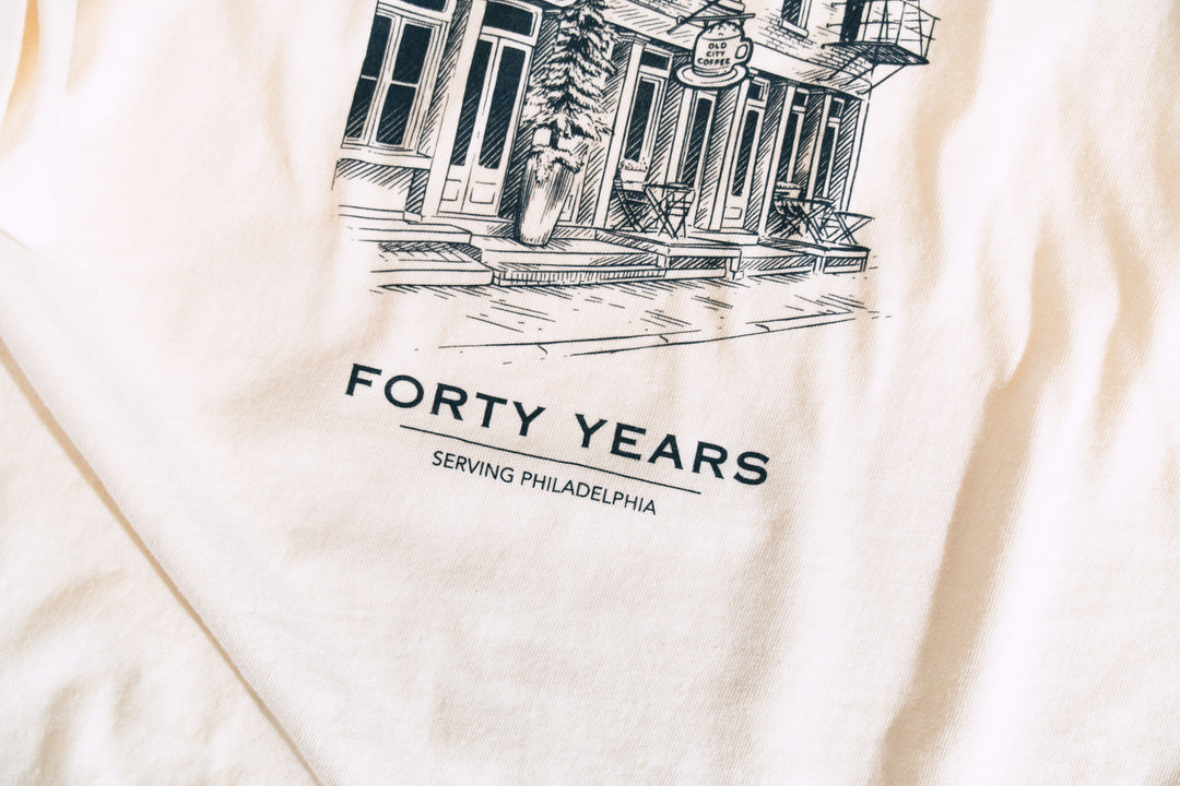 Close-up of the back print: the Old City Coffee storefront illustration above the words Forty Years