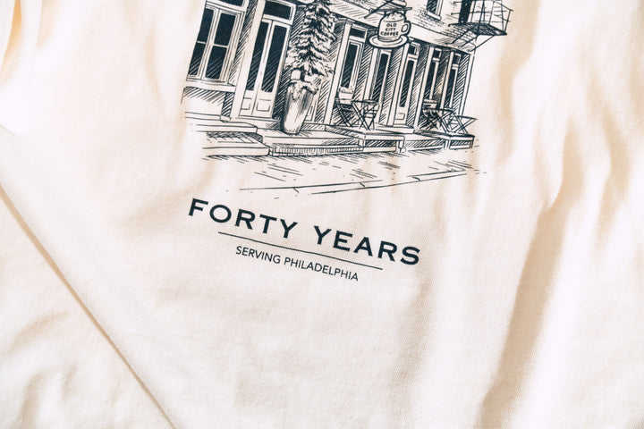 Close-up of the back print: the Old City Coffee storefront illustration above the words Forty Years
