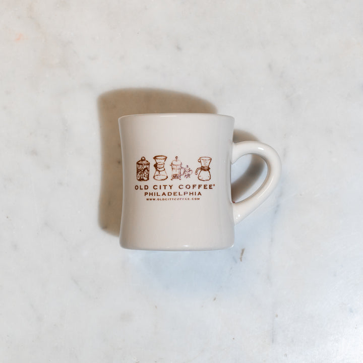White Old City Coffee diner mug viewed from above on a marble counter