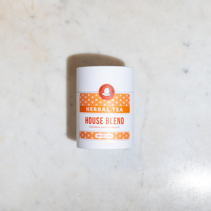 White Old City Coffee canister of House Blend herbal tea with an orange label