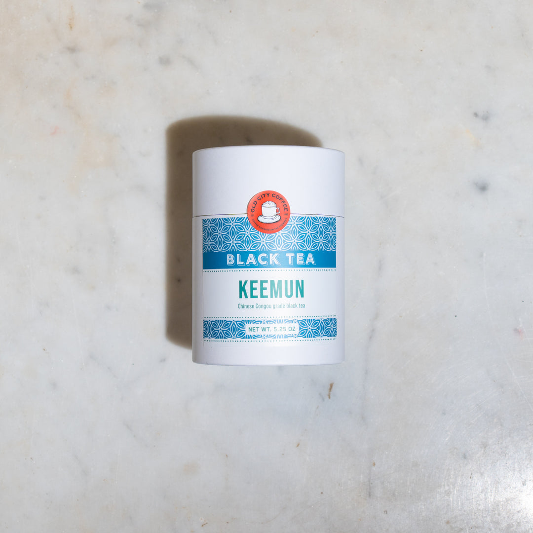 White Old City Coffee canister of Keemun black tea with a teal label